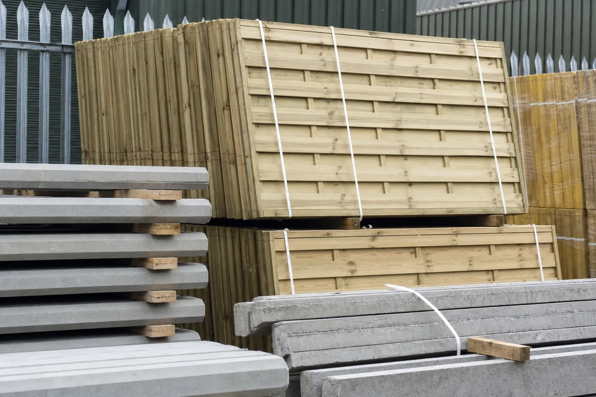 Timber fencing materials and concrete posts ready for installation in Lincoln